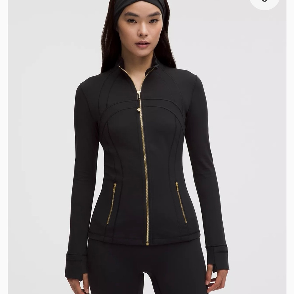 Never worn Lululemon Nunu Black Jacket with Gold Accents